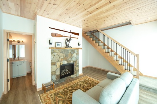 On the lowest level, the owners have a family room, as well as a bathroom and laundry space.