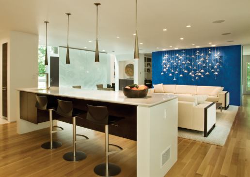 Swivel seats that are positioned in the kitchen facing the living room make it possible to take in what’s going on in both places. Project: Gupta Residence, Reston, Va.; Architect: Envision Design; Builder: Great Falls Construction