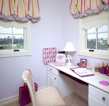 SWEET SUITE: Secondary bedrooms don’t get second-class treatment in this house. A cozy alcove off the main sleeping area of this girl’s room provides just enough personal space to spread out and work on school projects or to write love notes without disturbance. “Each bedroom is its own entity,” says architect Carson Looney. “It’s your own private oasis.”