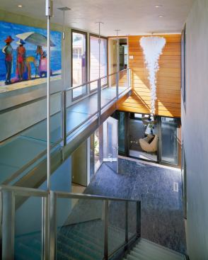 Looking down into the foyer from the glass hallway.