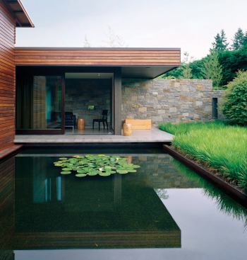A similar treatment floats the office over the central courtyard's pool.