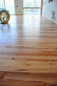 Hard to capture on camera the gloss level of Satin. It's my favorite finish. Notice the floors are finished before cabinet install.