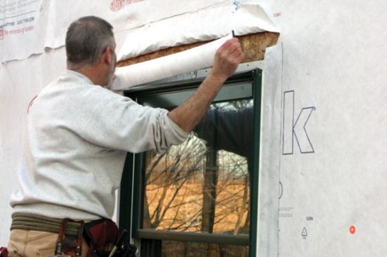 Next I apply flashing over the head flange...