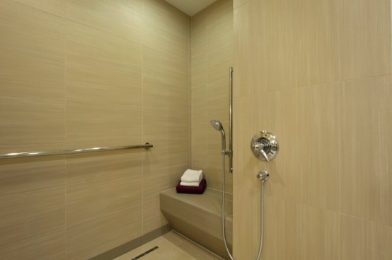 The shower was designed around an existing skylight to provide natural light during the day, resulting in a master bath that meets ADA requirments, with an overall impression of style and high function.  