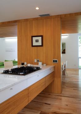 The luxury of airiness and light trumped the luxury of stuff in this kitchen.