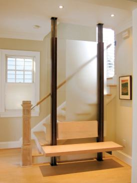 A wooden bench is suspended near the stairs.