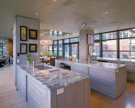 This Martha’s Vineyard home’s kitchen stays true to the design’s ethereal palette with&nbsp;frameless White Oak rift&nbsp;cabinetry that stays low to allow for plenty of windows above the countertop. Project: Lagoon Pond Pavilion, Vineyard Haven, Mass.; Builder: Rosbeck Builders Corp., Edgartown, Mass.; Architect: Hutker Architects, Vineyard Haven; Kitchen Designer: Jennifer Gilmer Kitchen and Bath, Chevy Chase, Md.