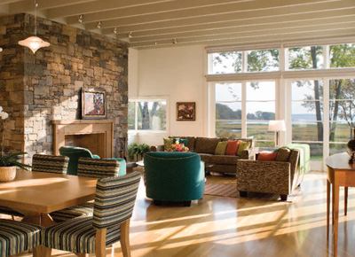 The owners, avid sailors who are at home in the elements, gave Twombly exact coordinates for the living room's orientation. So it's fitting that the house's materials and detailing are as crisp and straightforward as a marine vessel. Metal roofs, cedar shingle siding, deep overhangs, and exposed framing invite the bucolic backdrop to take center stage.