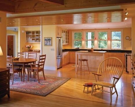 A new kitchen and modestly expanded dining area work the kinks out of the ell's old floor plan