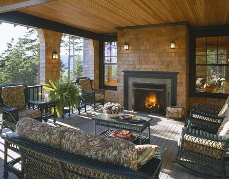 Even summers in coastal Maine can be chilly, so a large fireplace warms the covered porch producing a comfortable outdoor room that can be used most of the year.