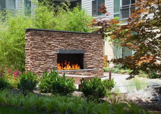 Outdoor fireplaces aren’t just for Californians. In Baltimore, a rustic-looking fireplace anchors a courtyard space in a mixed-use community that’s LEED certified—and a mix of young professionals, university professors, and empty-nesters. Architect: Sam Rajamanickam, Design Collective, Inc.; Builder: Mike Schlegel, The Bozzuto Group; Landscape Architect: Catherine Mahan, Mahan Rykiel Associates