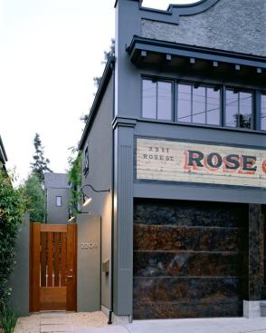 Owners are greeted by a warm wooden gate that leads to a private courtyard and garden.