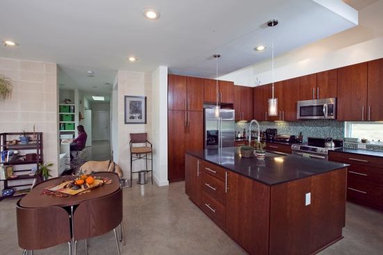 The interiors are a mix of concrete and bamboo floors, low VOC paints, FSC-certified woods, and Energy Star appliances.