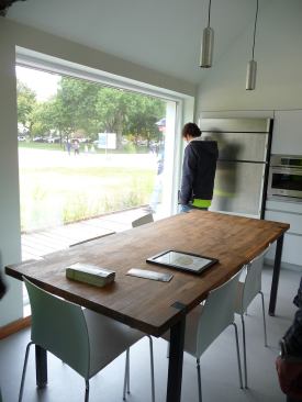 Daylighting makes this dining area comfortable without the use of electricity. The window systems, designed by Optiwin, meet Passive House standards.