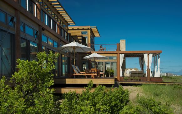 Cedar cross-beams call to mind a ship mast and boom. In the spirit of boat-making, dovetail joinery is used throughout the house, with little metal joinery exposed.