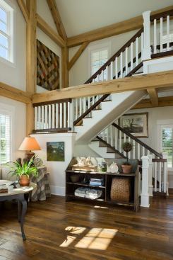 Two guest bedrooms and a bathroom occupy the top level, which mimics a hay loft.