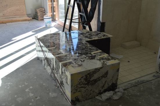 Marble enhances one of the home's many bathrooms.