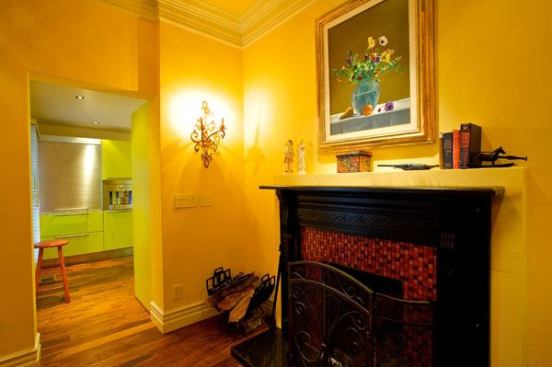 The old and the new: view from Victorian parlor into kitchen.