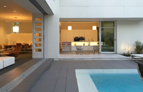 Courtyard view of Opened Living Room and kitchen