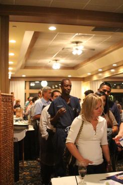 The 36 interested buyers lined up in the order their numbers were drawn to sign up for appointment times to view the lots and choose a home plan.