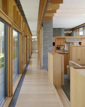 Interior columns and floor tiles are the same bluestone as the exterior walls, though in a more polished form.