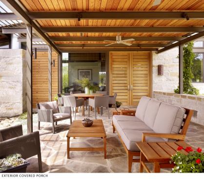 A covered porch is oriented to catch prevaliing breezes and provides a comfy spot to watch the sun set.