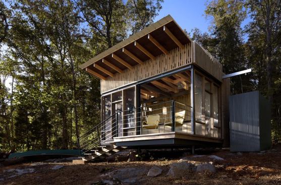 Cape Russell Retreat Award of Merit 
Sanders Pace Architecture   The architects designed and oversaw construction on a 176-square-foot 
lakeside pavilion in Sharps Chapel, Tenn., crafted to be an off-the-grid weekend getaway that features integrated water reclamation and photovoltaic technology. A secondary skin of 2x4 vertical cedar boards backed with an insect screen, offering visual transparency and passive cooling, is able to be attached via tabs on the lightweight steel structure. An 8-foot-by-8-foot sliding screen panel offers easy access to the waterfront while a cedar butterfly roof collects and directs rainwater to a cistern beside the pavilion.