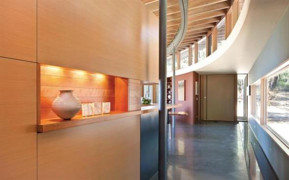 Clerestory windows direct views up into the forest canopy.