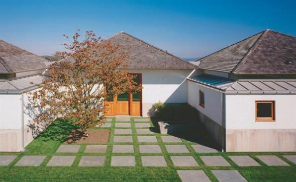 Entered via a sheltered courtyard, the building opens to distant views of the Hudson River and lights up like a beacon at night.