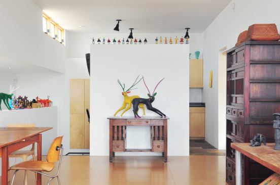 A floating wall separates the living room from the kitchen. Living room floors are made from low-VOC particular board with a low-VOC sealer laid over radiant-heat substrait. Finding ways to make industrial products into beautiful assemblages is part of the fun, says Browne. “We’re proud of this house because it does that in an interesting way,” he says.