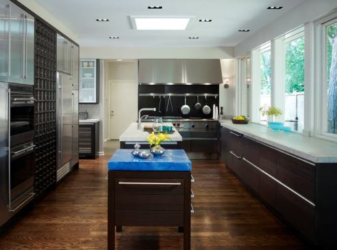 Mick de Giulio often layers multiple countertop materials in one space for a dramatic (and useful) effect.