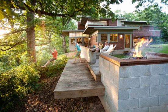 Scandinavian design informs this house, with an outdoor fire pit whose design follows the building’s modern lines. Architect: Matthias J. Pearson; Builder: Edward Ernst, Upriver Construction Company; Landscape Architect: Matthias J. Pearson