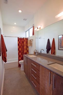 The light-filled bathroom features features KCMA certified cabinets.