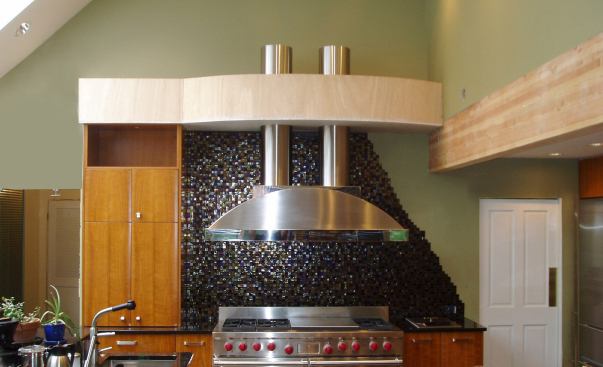 Brushed stainless steel with a mirror-polished decorative steel band. Project: Modern House, Spring Valley, N.Y.; Designer/Fabricator: Brooks Custom, Mt. Kisco, N.Y.