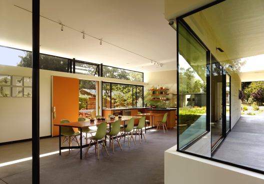 The award-winning kitchen has an island that's flexible enough to accommodate big parties, yet the scale feels right for every day. Here, the architect designed a table that breaks into three parts: One gets pushed against prep area of island to supply a kitchen-table component. The other two sit together as a dining table and slides over to join the other two for super-big parties. 
Project:
Hydeaway House, Sonoma, Calif. 
Architect: Schwartz and Architecture, San Francisco; 
Builder: Eames Construction, Petaluma, Calif.