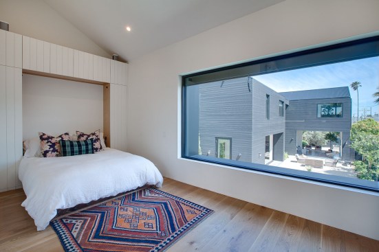 The studio over the garage overlooks the outdoor courtyard below.