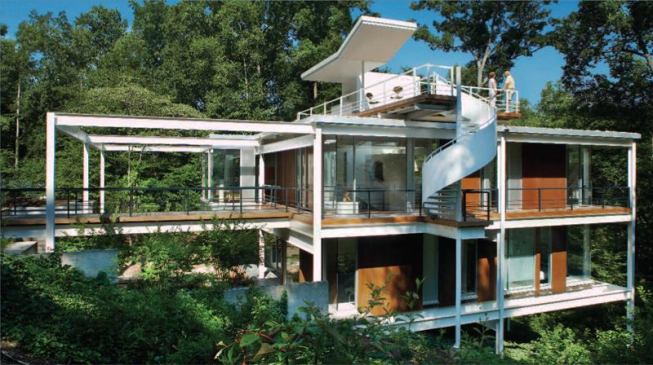 Once hidden in flush perimeter walls, the steel frame now forms a pronounced exoskeleton.