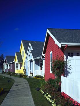 Architects William Kreager, FAIA, and Dick Bruskrud tied the community together visually with crisp white trim and picket fences.
