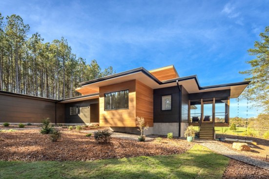 The screened porch seems to float above the landscape.