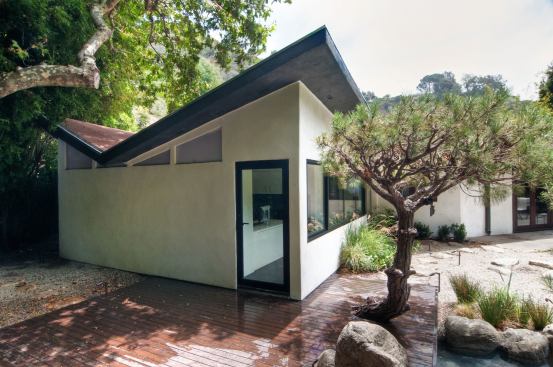 The library/office has exterior access so that clients for the homeowner's legal practice don't have to walk through private areas of the house.