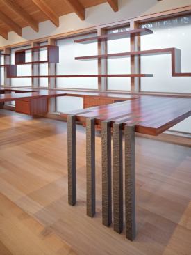 The desk legs are aluminum, cast in a pattern of Finne’s design and coated in bronze.