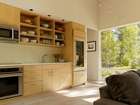 Guests often comment on the vertical subway tile in the kitchen, Carney says. The 12-foot-long space echoes the serene palette of the rest of the project.