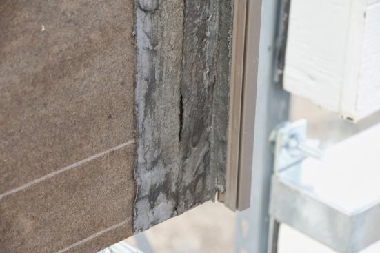 Zoomed in on the Tar Paper "Window Flange" detail that's looking bad after a short period of time.  Not good.