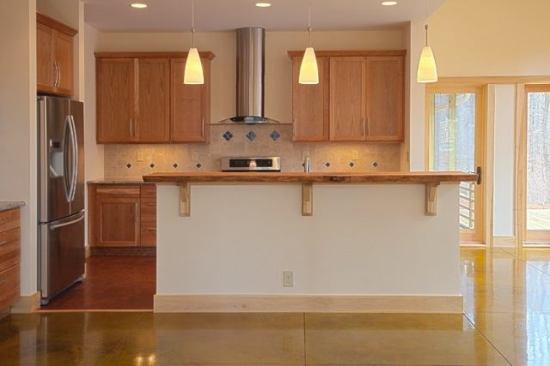 A house is built to maximize solar gain in the winter and manage heat in the summer.