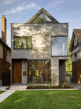 Recessed corners echo a theme that appears in neighboring houses and help brighten the interior.
