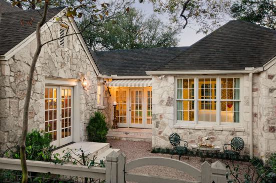 Part of the mission in updating this 1930s cottage was to preserve its original charm, even while making a significant addition. The stone exterior preserves the cottage flavor and lends a sense of permanence without appearing dated. Project: Bowman Residence, Austin, Texas; Builder: Texas Construction Co., Austin; Architect: Cuppett Architects, Austin; Designer: Sharon Wilkes, Austin