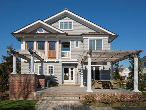 The pergola on the home's south elevation is made of cedar, and wisteria has been planted.