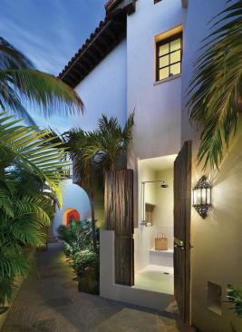 An outdoor shower is tucked off the main area.
