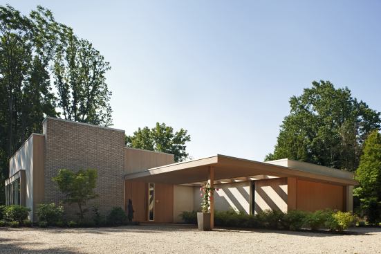 Eastern White Cedar treated with a light stain adds warmth and texture to stucco and pewter-gray brick on the exterior of this modern house. Location: West Orange, N.J.; Architect: Deborah Berke and Partners