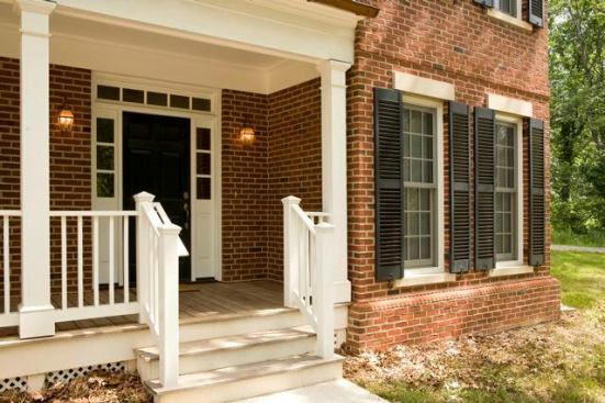 A front porch greets visitors as they approach one of the homes.